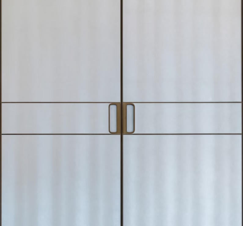 Profile handle and waistline detail of an antelope leather wardrobe