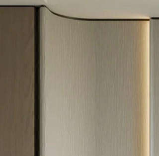 Curved leather wall panel detail in a custom walk-in wardrobe