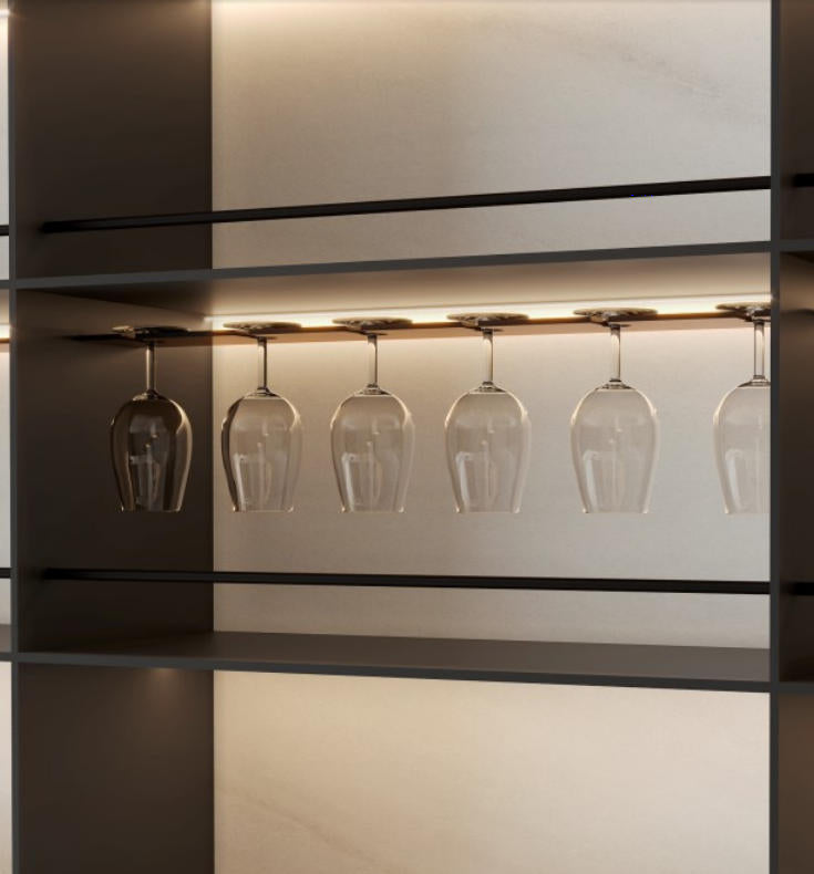 Aluminium wine glass rack with hanging stemware in the social kitchen